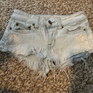 American eagle Jean shorts with lace appliqué.